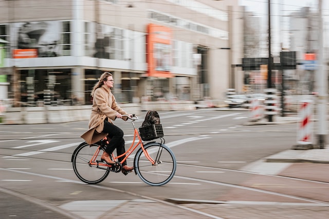 A woman on a bike on her way to work. 