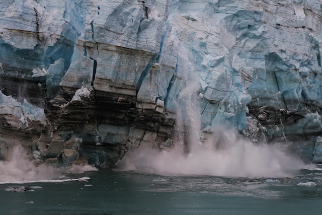 A calving glacier, a testament to the ongoing threat of climate change.