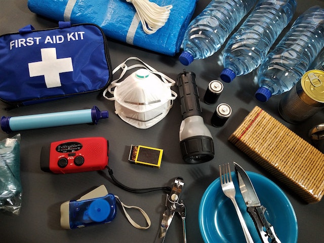 An assortment of essentials to pack in a survival kit. 