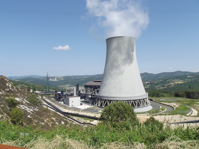 Steam rises out of a cooling tower at a geothermal power plant