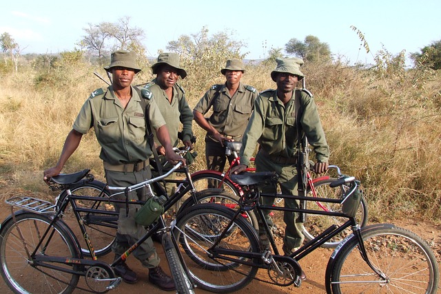 Park rangers pose with their bicycles
