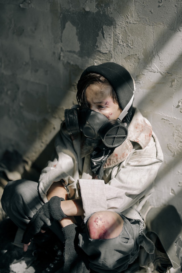 A child wearing a gas mask