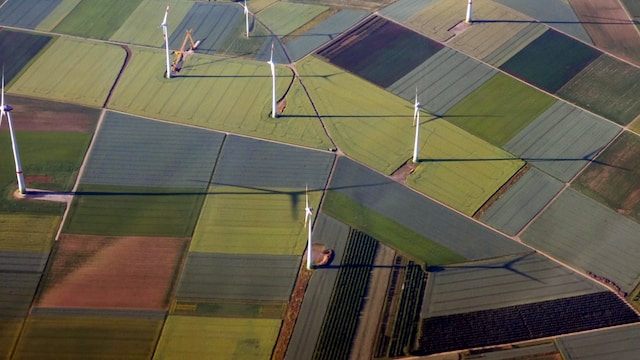Aerial view of wind turbines in a field