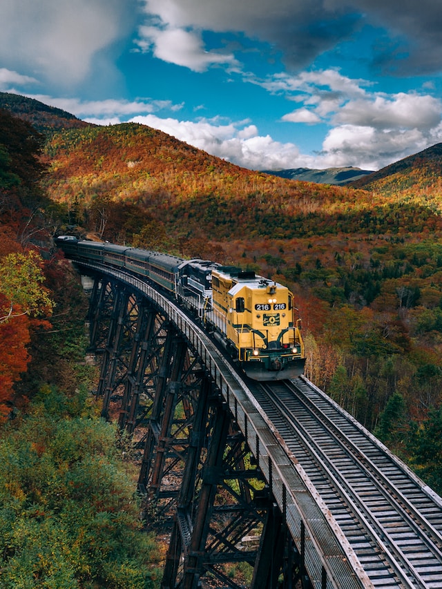 Train passing through a picturesque autumn landscape